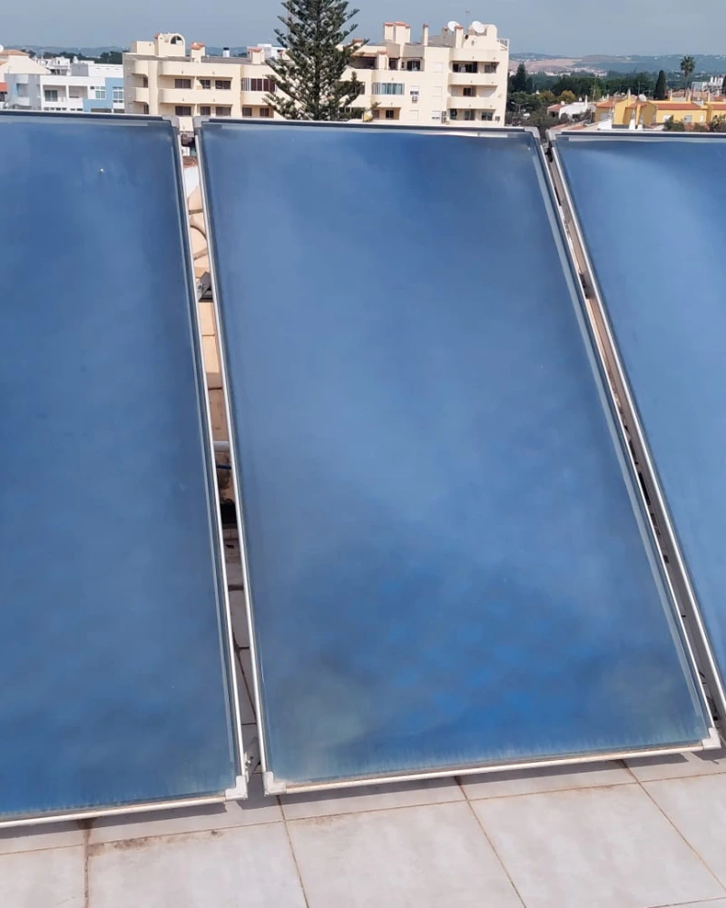 Solar panel repair and maintenance on an Algarve villa rooftop