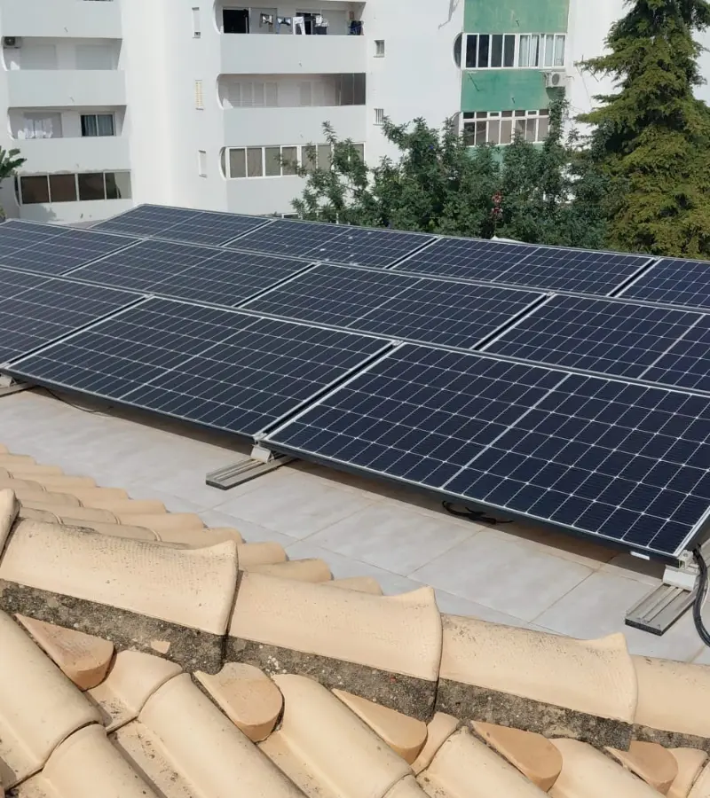Solar panels on a rooftop in the Algarve, repaired by a licensed electrician